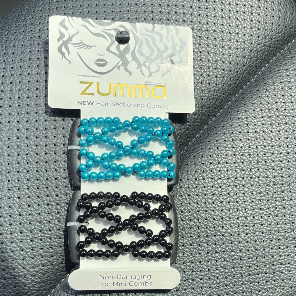 Blue and Black Hair Combs. New in pkg.